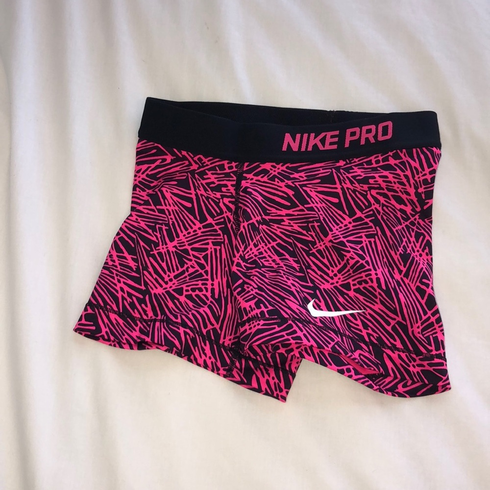 neon pink patterned nike pros